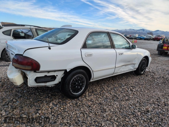 1999 Mazda 626 ES z VIN 1YVGF22C9X5887587, wystawiony jako Copart lot #46346305 z przebiegiem 92 715 mil mil oraz Szkoda całkowita • Salvage title. Historia ofert i sprzedaży dostępna na DreamBid. Obrazek 3.