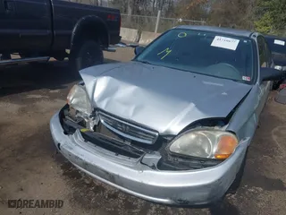 1996 Honda Civic DX with VIN 2HGEJ6627TH550103, listed as a IAAI auction lot 41710877 with 142,608 mi miles. Bid and sale history available at carsss.com. Image 6.