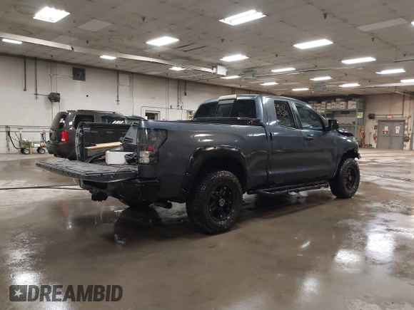 2009 Toyota Tundra 4WD Truck with VIN 5TFBW54199X091510, listed as a IAAI auction lot 42025369 with 234,784 mi miles. Bid and sale history available at carsss.com. Image 4.