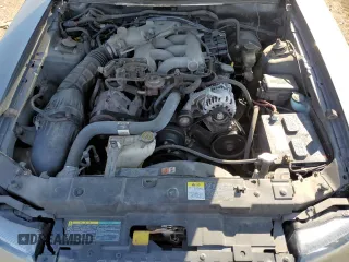 2004 Ford Mustang Standard z VIN 1FAFP40654F138305, wystawiony jako Copart lot #65882195 z przebiegiem 89 404 mil mil oraz Czysty tytuł • Clean title. Historia ofert i sprzedaży dostępna na DreamBid. Obrazek 11.