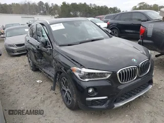 2018 BMW X1 xDrive28i with VIN WBXHT3C34J5K21576, listed as a IAAI auction lot 41822390 with 69,645 mi miles. Bid and sale history available at carsss.com. Image 1.