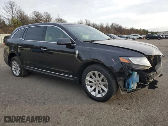 2019 Lincoln MKT with VIN 2LMHJ5NKXKBL02985, listed as a Copart auction lot 80615654 with 112,112 mi miles and Salvage Title. Bid and sale history available at DreamBid. Image 4.