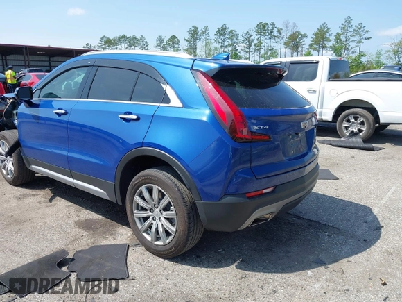 2023 Cadillac XT4 FWD Premium Luxury z VIN 1GYFZCR43PF104796, wystawiony jako IAAI lot #41931695 z przebiegiem 12 666 mil mil oraz . Historia ofert i sprzedaży dostępna na DreamBid. Obrazek 3.
