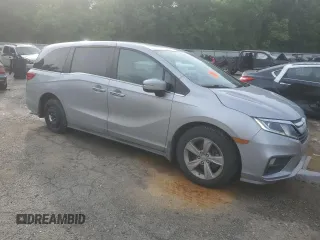 2018 Honda Odyssey EX-L with VIN 5FNRL6H74JB099282, listed as a Copart auction lot 55031025 with 137,359 mi miles and Salvage Title. Bid and sale history available at DreamBid. Image 4.