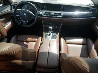 2014 BMW 5 Series GT 550i xDrive with VIN WBA5M0C5XED084908, listed as a Copart auction lot 50619945 with 97,680 mi miles and Salvage Title. Bid and sale history available at carsss.com. Image 8.