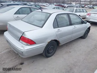 2002 Mitsubishi Lancer ES with VIN JA3AJ26E62U060214, listed as a IAAI auction lot 40961872 with 150,399 mi miles. Bid and sale history available at carsss.com. Image 4.