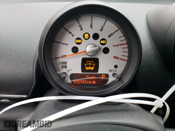 2014 MINI Countryman S with VIN WMWZC3C52EWP25379, listed as a Copart auction lot 61438355 with 76,943 mi miles and Salvage title. Bid and sale history available at DreamBid. Image 9.