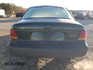 1997 Saturn SL z VIN 1G8ZH5285VZ122690, wystawiony jako Copart lot #81655244 z przebiegiem 159 048 mil mil oraz Szkoda całkowita • Salvage title. Historia ofert i sprzedaży dostępna na DreamBid. Obrazek 6.