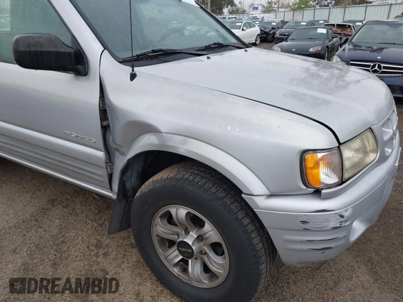 2001 Isuzu Rodeo S with VIN 4S2CK58W614361048, listed as a IAAI auction lot 41681566 with 133,460 mi miles and . Bid and sale history available at DreamBid. Image 6.