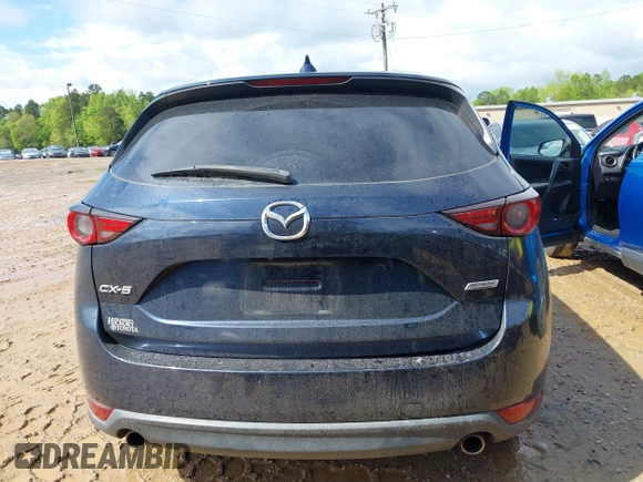 2018 Mazda CX-5 Grand Touring z VIN JM3KFADM8J1406007, wystawiony jako IAAI lot #42008567 z przebiegiem 110 661 mil mil oraz . Historia ofert i sprzedaży dostępna na DreamBid. Obrazek 16.