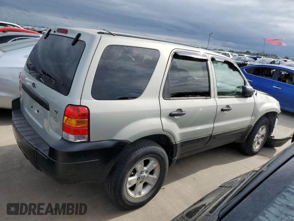 2005 Ford Escape XLT with VIN 1FMYU93105KC50944, listed as a Copart auction lot 50500965 with 133,532 mi miles and Salvage Title. Bid and sale history available at DreamBid. Image 3.