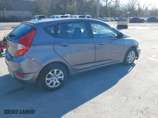 2014 Hyundai Accent GS with VIN KMHCT5AE6EU174338, listed as a IAAI auction lot 41096955 with 49,614 mi miles. Bid and sale history available at carsss.com. Image 4.