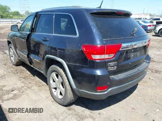 2011 Jeep Grand Cherokee Laredo with VIN 1J4RR4GG8BC525701, listed as a IAAI auction lot 42240431 with 198,921 mi miles and . Bid and sale history available at DreamBid. Image 3.
