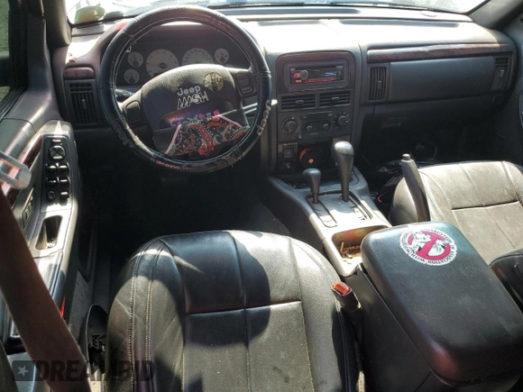 2001 Jeep Grand Cherokee Limited with VIN 1J4GW58N11C721108, listed as a Copart auction lot 60176915 with 257,907 mi miles and Salvage title. Bid and sale history available at DreamBid. Image 8.