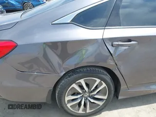 2020 Honda Accord with VIN 1HGCV3F11LA015901, listed as a IAAI auction lot 42022659 with 131,865 mi miles and . Bid and sale history available at DreamBid. Image 6.