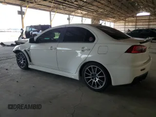 2010 Mitsubishi Lancer Evolution SE with VIN JA32W6FV8AU034077, listed as a Copart auction lot 64098154 with 120,041 mi miles and Salvage Title. Bid and sale history available at carsss.com. Image 2.