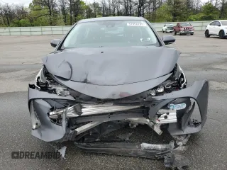 2021 Toyota Prius LE z VIN JTDKAMFP1M3172737, wystawiony jako Copart lot #57056205 z przebiegiem Nie podano mil oraz Szkoda całkowita • Salvage title. Historia ofert i sprzedaży dostępna na DreamBid. Obrazek 5.