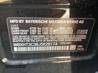 2018 BMW X1 xDrive28i with VIN WBXHT3C38J5K28174, listed as a Copart auction lot 57333385 with 50,064 mi miles and Salvage title. Bid and sale history available at DreamBid. Image 12.