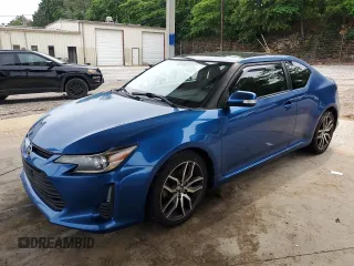 2014 Scion tC z VIN JTKJF5C76E3087992, wystawiony jako Copart lot #56058445 z przebiegiem 84 387 mil mil oraz Tytuł czysty. Historia ofert i sprzedaży dostępna na DreamBid. Obrazek 1.