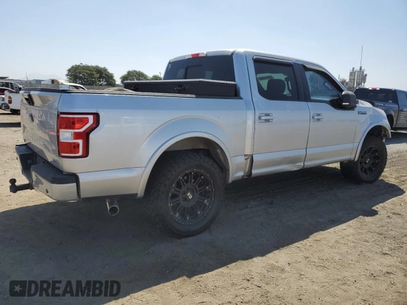 2018 Ford F-150 XL with VIN 1FTEW1CGXJFB40297, listed as a Copart auction lot 69642404 with 92,561 mi miles and Salvage title. Bid and sale history available at DreamBid. Image 3.