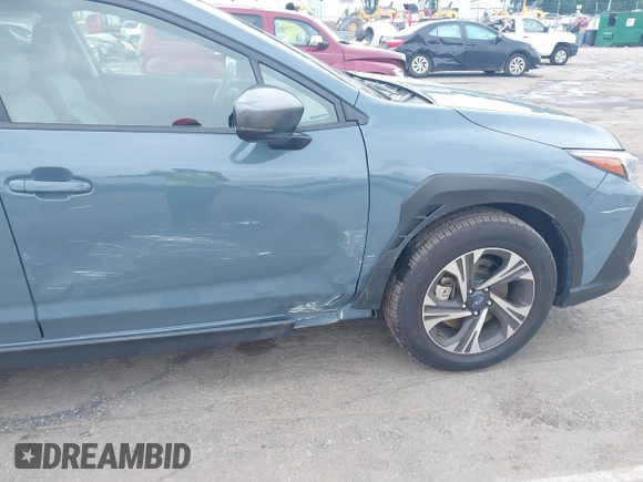 2024 Subaru Crosstrek Premium z VIN JF2GUADC7R8299418, wystawiony jako IAAI lot #42358005 z przebiegiem 21 690 mil mil oraz . Historia ofert i sprzedaży dostępna na DreamBid. Obrazek 6.