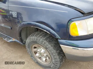 2002 Ford F-150 XL with VIN 2FTPX18L32CA67220, listed as a IAAI auction lot 42077154 with 233,409 mi miles. Bid and sale history available at carsss.com. Image 6.