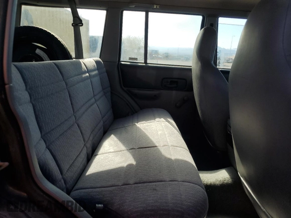 1997 Jeep Cherokee SE with VIN 1J4FT28S3VL523807, listed as a Copart auction lot 46674525 with 144,635 mi miles and Clean title. Bid and sale history available at DreamBid. Image 11.