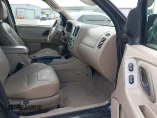 2005 Ford Escape Limited with VIN 1FMYU04155KE48512, listed as a IAAI auction lot 42196239 with 307,005 mi miles and . Bid and sale history available at DreamBid. Image 5.