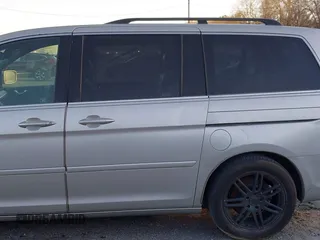 2006 Honda Odyssey Touring z VIN 5FNRL38856B098897, wystawiony jako IAAI lot #41251740 z przebiegiem 258 408 mil mil oraz . Historia ofert i sprzedaży dostępna na DreamBid. Obrazek 6.