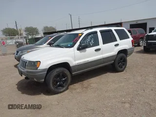 2002 Jeep Grand Cherokee with VIN 1J8GW38S62C219396, listed as a IAAI auction lot 41831930 with 196,167 mi miles and . Bid and sale history available at DreamBid. Image 2.