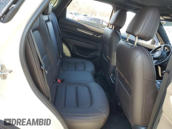 2021 Mazda CX-5 Signature with VIN JM3KFBEY5M0447759, listed as a Copart auction lot 42565535 with 24,175 mi miles and Salvage Title. Bid and sale history available at carsss.com. Image 11.
