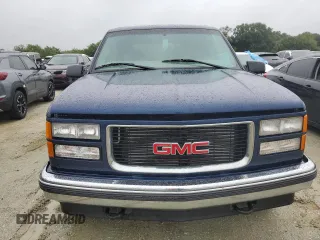 1999 GMC Yukon with VIN 1GKEK13R2XJ739931, listed as a Copart auction lot 74583734 with 115,605 mi miles and Salvage Title. Bid and sale history available at carsss.com. Image 5.