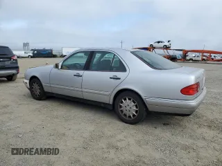 1999 Mercedes-Benz E-Class with VIN WDBJF65H0XA797390, listed as a Copart auction lot 55081405 with 80,950 mi miles and Salvage Title. Bid and sale history available at carsss.com. Image 2.