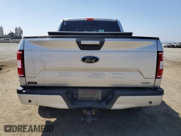 2018 Ford F-150 XL with VIN 1FTEW1CGXJFB40297, listed as a Copart auction lot 69642404 with 92,561 mi miles and Salvage title. Bid and sale history available at DreamBid. Image 6.