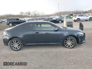 2015 Scion tC with VIN JTKJF5C7XFJ001662, listed as a IAAI auction lot 41843123 with 128,851 mi miles. Bid and sale history available at carsss.com. Image 13.