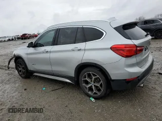 2017 BMW X1 sDrive28i with VIN WBXHU7C33H5H34013, listed as a Copart auction lot 38409444 with 87,558 mi miles and Salvage Title. Bid and sale history available at carsss.com. Image 2.