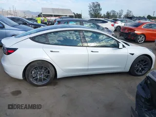 2022 Tesla Model 3 with VIN 5YJ3E1EA8NF210196, listed as a IAAI auction lot 41674407 with 24,270 mi miles. Bid and sale history available at carsss.com. Image 13.