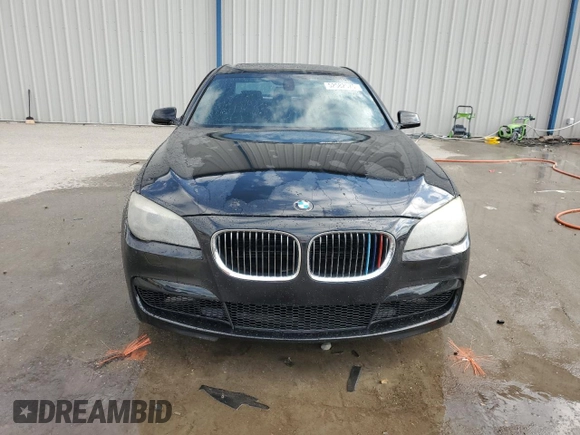 2011 BMW 7 Series 740i with VIN WBAKA4C52BC612977, listed as a Copart auction lot 52582575 with 157,813 mi miles and Salvage Title. Bid and sale history available at carsss.com. Image 5.