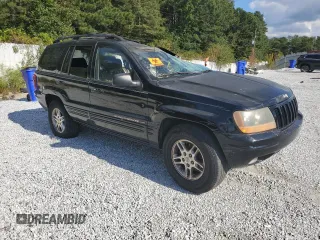 2000 Jeep Grand Cherokee Laredo with VIN 1J4G258S5YC193875, listed as a Copart auction lot 74731704 with Not provided miles and Salvage title. Bid and sale history available at DreamBid. Image 4.