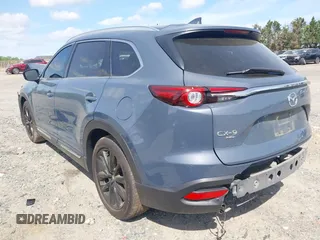 2022 Mazda CX-9 Grand Touring with VIN JM3TCBDY8N0628886, listed as a IAAI auction lot 42074044 with 67,867 mi miles and . Bid and sale history available at DreamBid. Image 3.