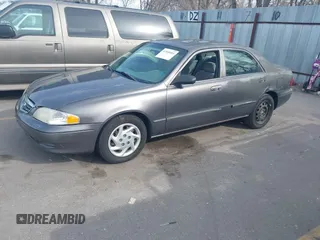 2001 Mazda 626 LX with VIN 1YVGF22C815218444, listed as a IAAI auction lot 41940404 with 143,080 mi miles. Bid and sale history available at carsss.com. Image 2.