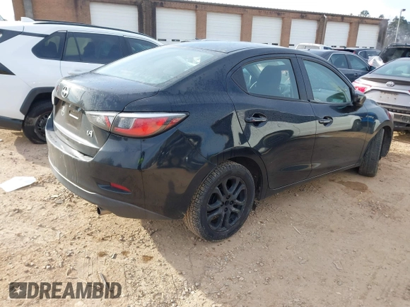 2016 Scion iA with VIN 3MYDLBZV2GY128048, listed as a IAAI auction lot 41402836 with 84,371 mi miles. Bid and sale history available at carsss.com. Image 4.
