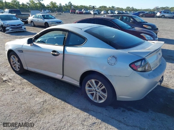 2008 Hyundai Tiburon GS with VIN KMHHM66D98U292591, listed as a IAAI auction lot 42021445 with 219,750 mi miles. Bid and sale history available at carsss.com. Image 3.