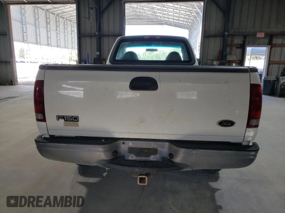 2000 Ford F-150 XL with VIN 1FTZF182XYNC09505, listed as a Copart auction lot 73420184 with 296,202 mi miles and Salvage title. Bid and sale history available at DreamBid. Image 6.