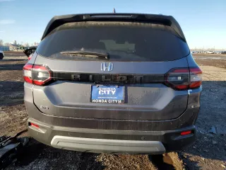 2025 Honda Pilot EX-L with VIN 5FNYG1H44SB063991, listed as a Copart auction lot 47678335 with 5 mi miles and Salvage title. Bid and sale history available at DreamBid. Image 6.