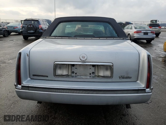 1994 Cadillac Concours z VIN 1G6KF52Y3RU231877, wystawiony jako Copart lot #82150174 z przebiegiem 76 279 mil mil oraz Szkody całkowita. Historia ofert i sprzedaży dostępna na DreamBid. Obrazek 6.