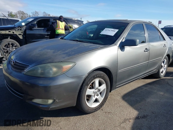 2003 Toyota Camry LE with VIN 4T1BE32K43U760354, listed as a IAAI auction lot 41547088 with 257,688 mi miles and . Bid and sale history available at DreamBid. Image 2.
