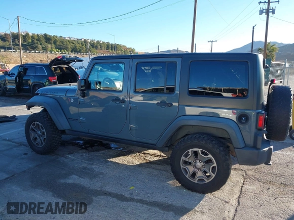 2014 Jeep Wrangler Unlimited Rubicon X with VIN 1C4BJWFG3EL134522, listed as a IAAI auction lot 41221381 with 66,897 mi miles and . Bid and sale history available at DreamBid. Image 14.