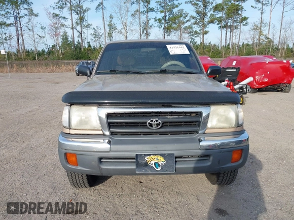 1999 Toyota Tacoma with VIN 4TAPM62NXXZ439318, listed as a IAAI auction lot 41721442 with 299,876 mi miles and . Bid and sale history available at DreamBid. Image 6.
