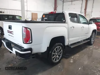 2021 GMC Canyon 4WD Denali with VIN 1GTG6EEN0M1229180, listed as a IAAI auction lot 41298304 with 55,865 mi miles. Bid and sale history available at carsss.com. Image 4.
